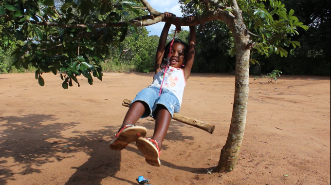 Dalfa playing on her own-made swing