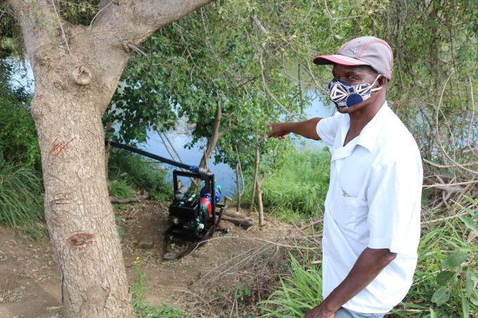 Miguel Ngovene shows his water pump and says that they produce to also take care of the most disadvantaged children in the community.